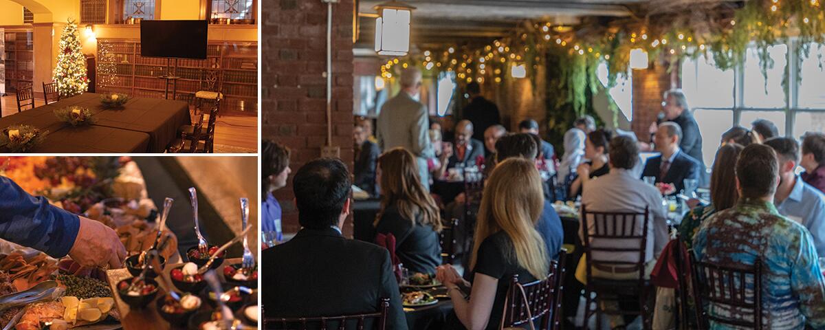 Amusement room with presentation tv, hand grabbing food on a table, a large crowd of guests seated at round tables.