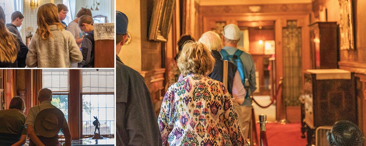 kids looking in white wallpapered room, couple looking at artifacts on a table, group walking in upstairs hallway.