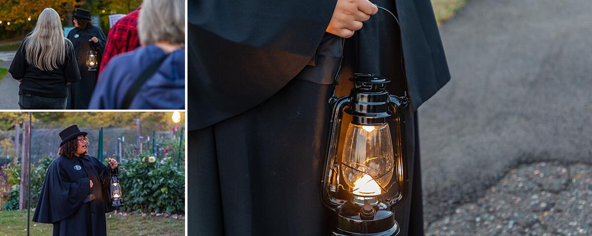 tour guide wearing a black cloak and holding a lit lantern, guests following.