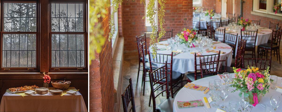 small table with food and plates, large brick room with round tables set up for a dinner.