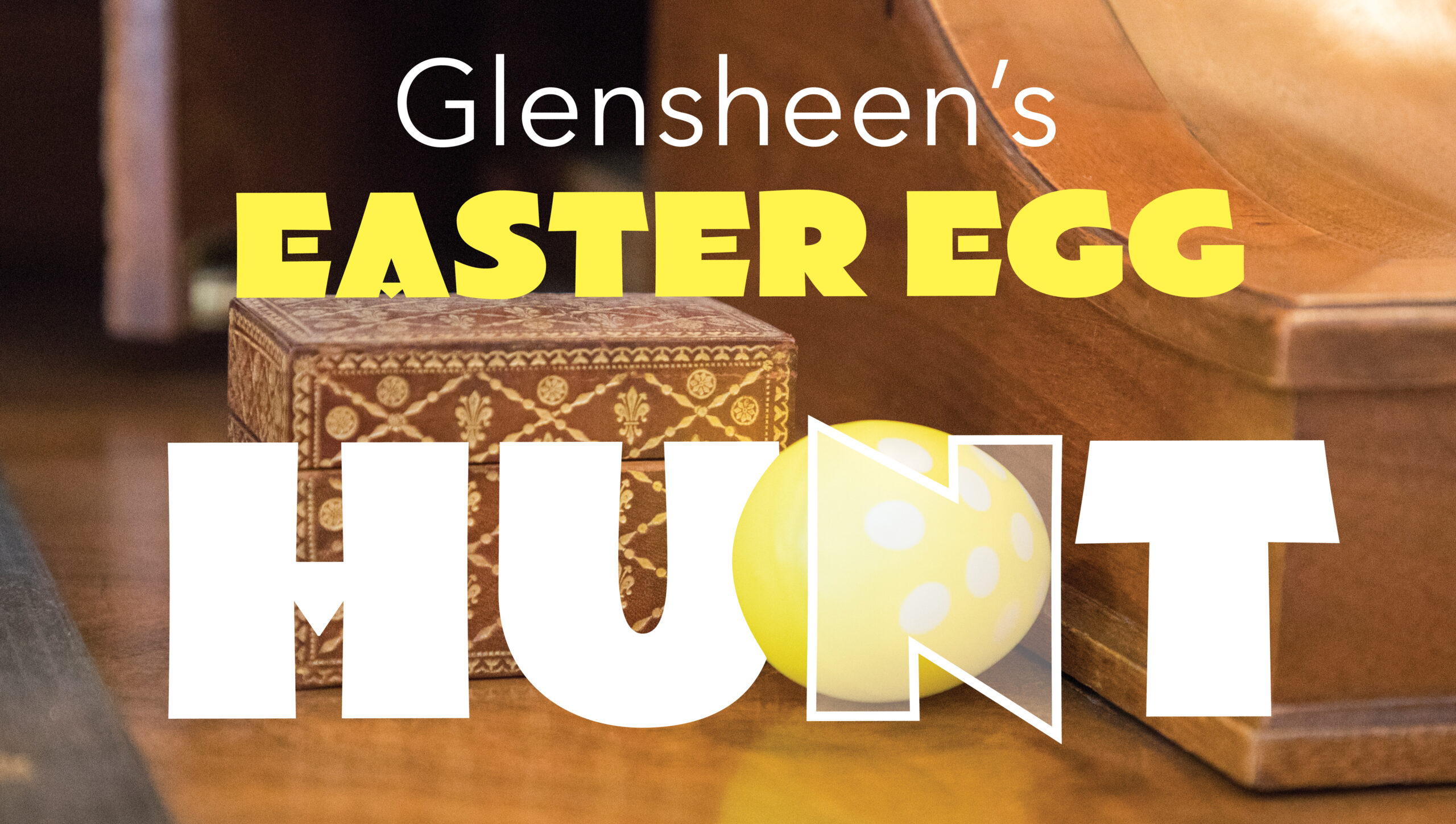 Glensheen's Easter Egg Hunt with a yellow egg on a wooden table.